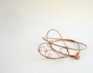 Copper wire wrapped heart pendant with natural leather string.
